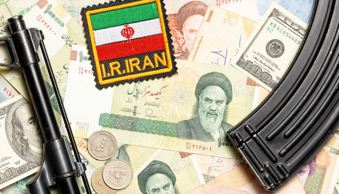 Soviet automaton AK 47 against the backdrop of Iranian money depicting Ruhollah Khomeini and Iranian flag