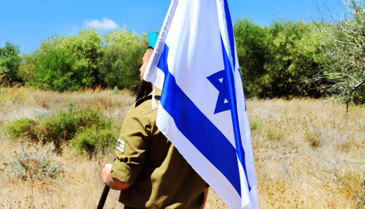 Israeli soldier with Israel flag