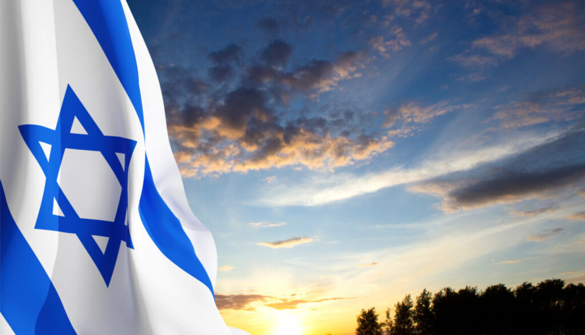 Israel flag with a star of David against the sunset