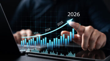 New Business Plan Setting Goals for the New Year 2026, businessman using laptop and tablet to strategize and develop the organization to grow to success in 2026, finding business opportunities.