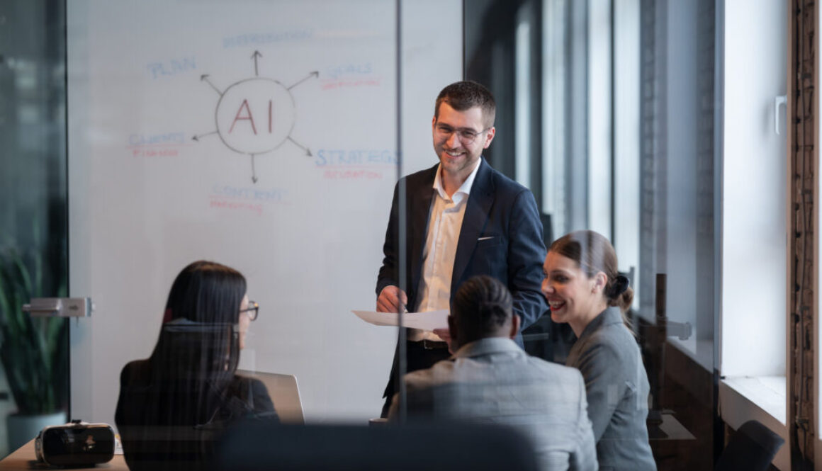 Diverse business team in a modern office during a meeting, discussing artificial intelligence strategy. Concept of AI innovation, teamwork, leadership, corporate planning, professional collaboration