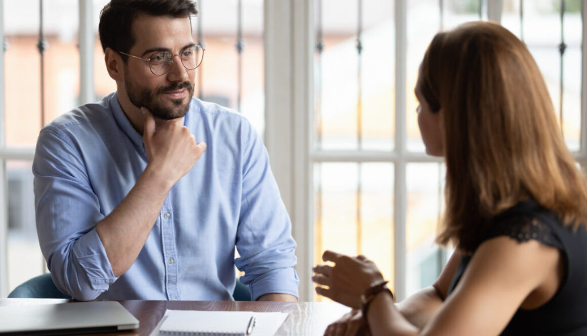 HR manger listening female applicant during job interview