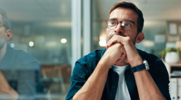 Reflection, thinking and business man with idea, creative insight or professional mindset. Planning, vision and serious worker with inspiration, problem solving and writer by glass in startup office