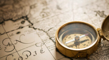 Compass with vintage map