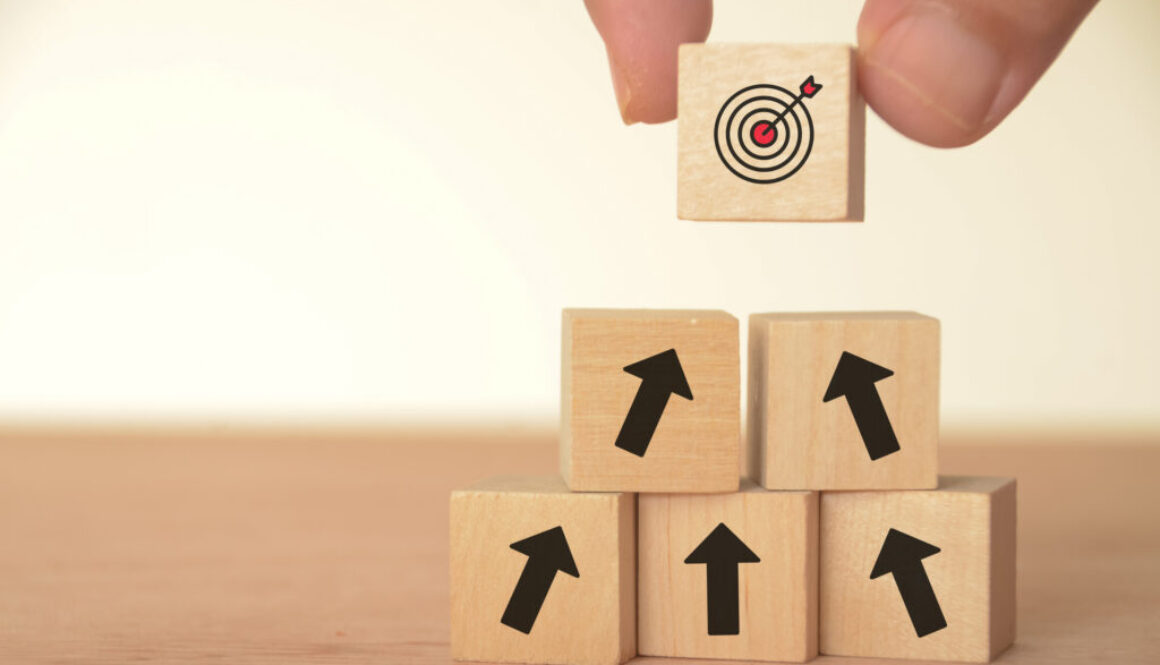 The image of a target block atop arrows suggests a clear path toward achieving goals.