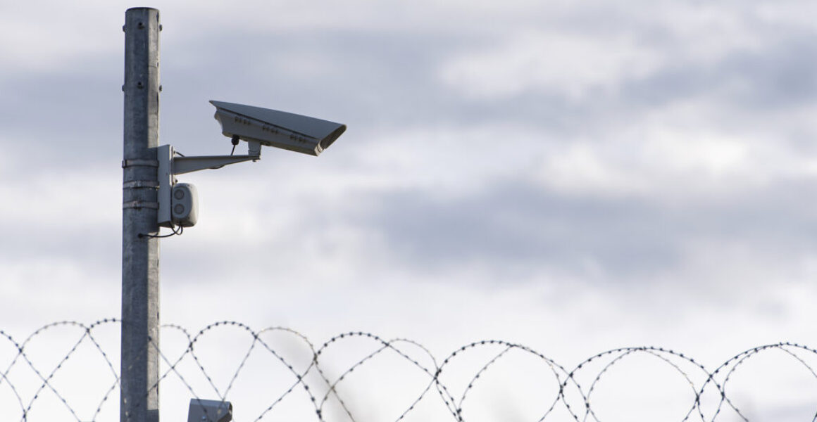 Surveillance Camera and barbed wire, border, prison, concept picture Washington Examiner Op-Ed Discusses LEO Technologies’ Verus Vision AI