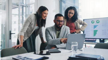 Teamwork, meeting and ideas for solution or decision for business, workplace or company. Group, people and discussion with technology in planning, collaboration for growth in brainstorming or project Elliott Broidy in Fast Company on Whether AI Belongs on the Team